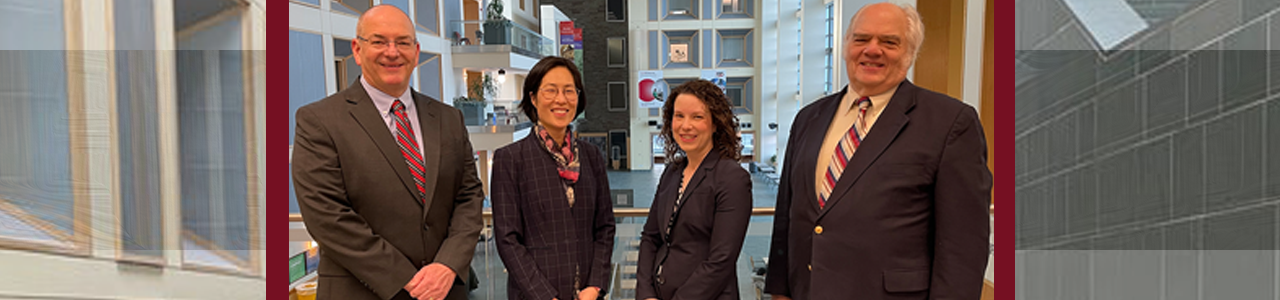 CNF Directors Ron Olson, Judy Cha, Allison Godwin, and Lynn Rathbun pose for a picture in the Duffield Hall atrium