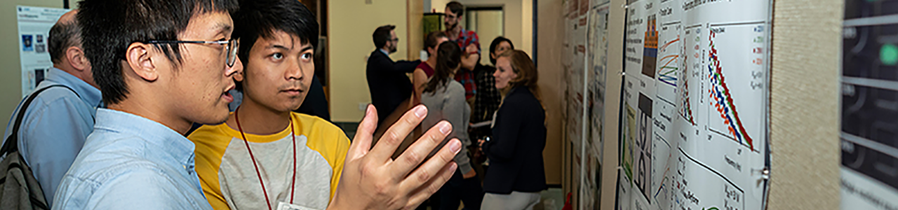 Discussing a poster at the CNF Annual Meeting poster soiree