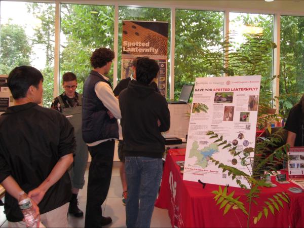 Visitors at the CNF Spotted Lantern Fly exhibit