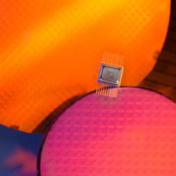 Image of a chip on top of multiple wafers; credit ChernishevVI