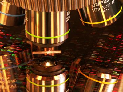 Microscope examining a wafer and reflecting off the wafer